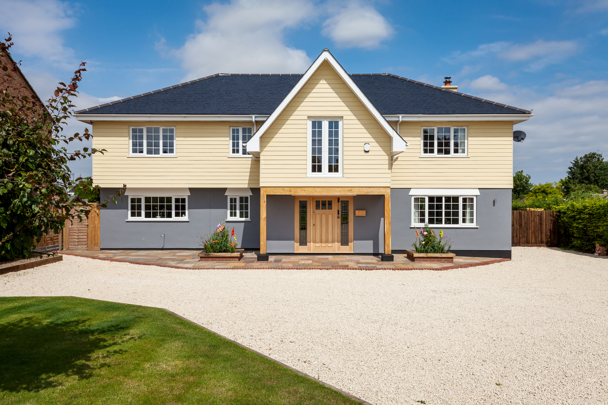 Duxford, Cambridgeshire, England - July 16 2015: Contemporary modern new house bathed in sunshine